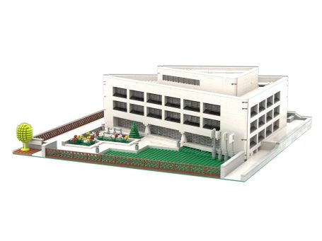 Edificio Oficinas Endress Hauser (Barcelona) MOC Lego - Vista exterior 2 Edificio moderno con jardín y área recreativa, diseño minimalista y estructura blanca.